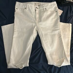 Size 26 cream/white ripped skinny jeans from free people.